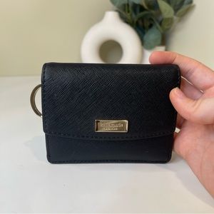 black Kate spade wallet with gold details.